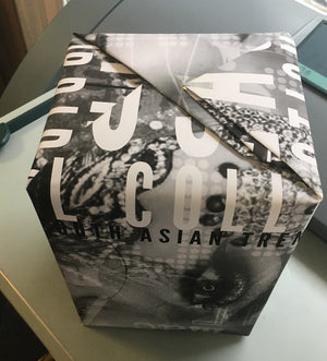 Parcel wrapped in bespoke black and white printed paper